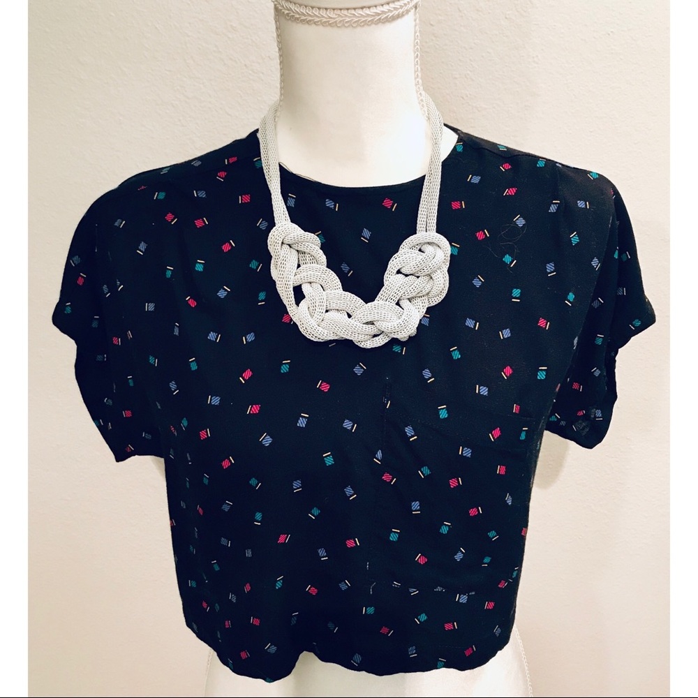 White 80’s style necklace.